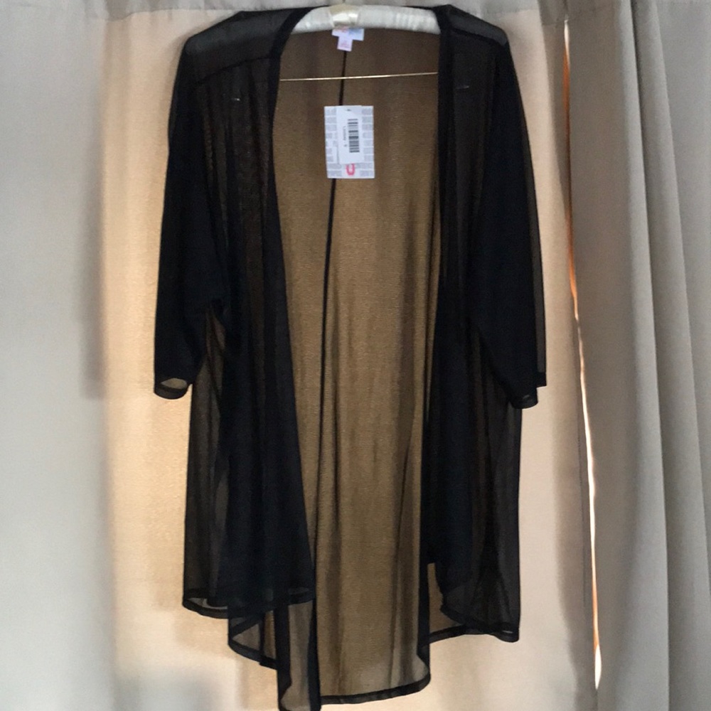 Black LuLaRoe, Lindsay, size small.. see-throu, has a faint design on it